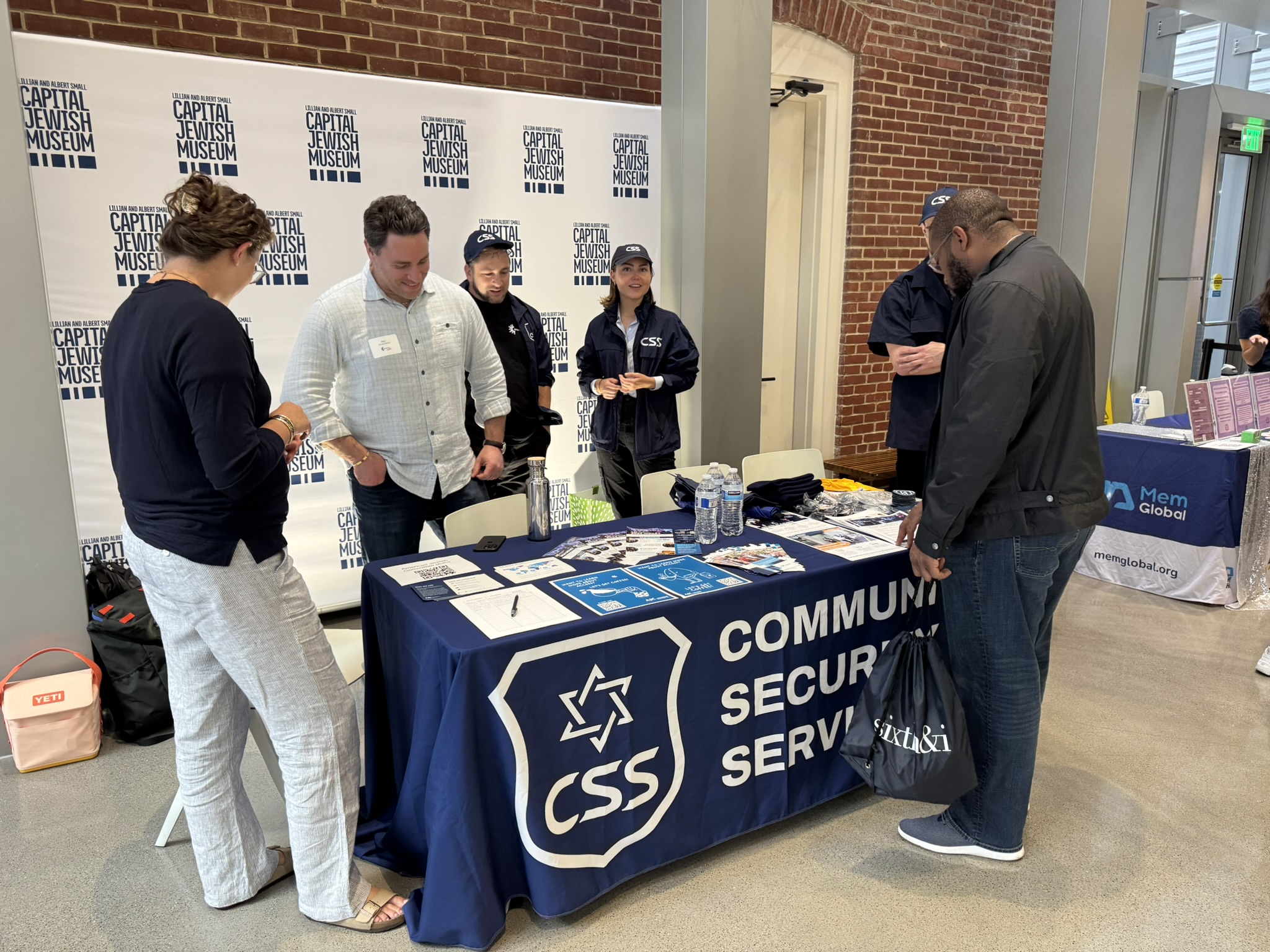 Community Security Service table with attendees at ConnectJew LIVE!