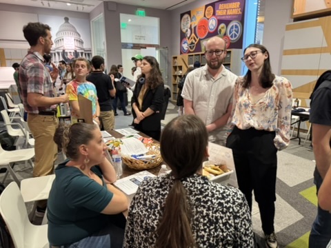 Attendees and organization representatives talking at the Capital Jewish Museum during ConnectJew LIVE!